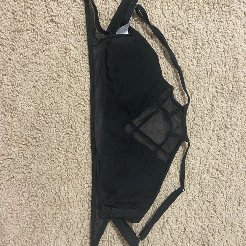 Black bathing suit top with mesh.